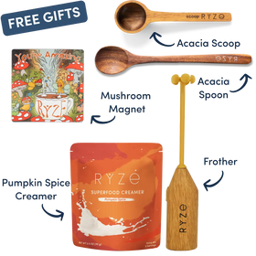 A bundle of RYZE-branded gift items on a white background, including a wooden Acacia Spoon, a wooden Acacia Scoop, a Mushroom Magnet, a Pumpkin Spice Creamer pouch, and a wooden Frother, with a 'FREE GIFTS' banner at the top left.