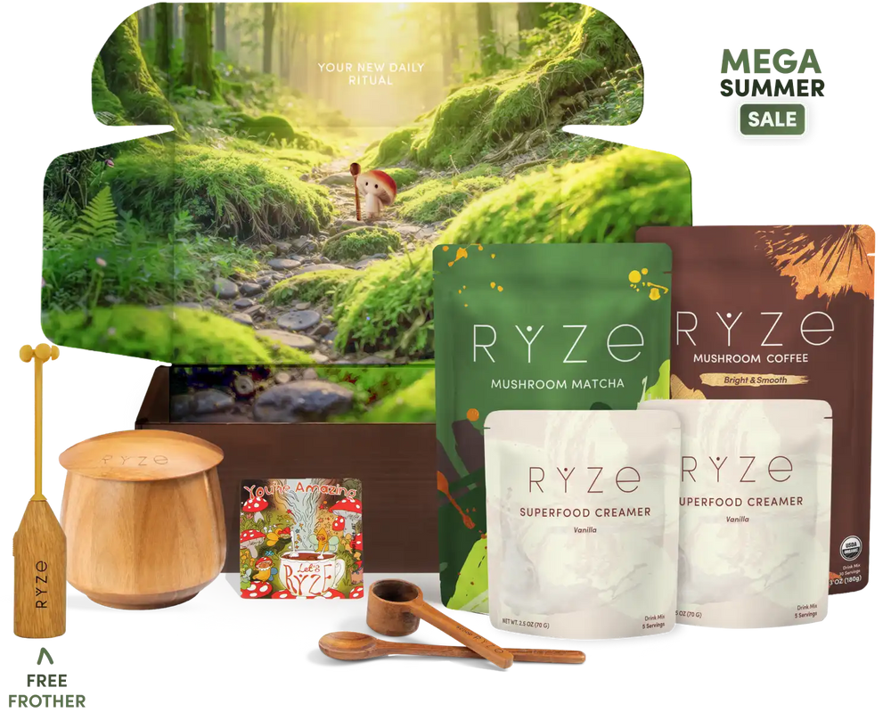A RYZE gift set featuring mushroom matcha and mushroom coffee in pouches, a wooden container with a wooden spoon, a wooden frother, and a small illustrated magnet, arranged in front of a large forest-themed box. Text on the image includes 'MEGA SUMMER SALE' and 'FREE FROTHER'.